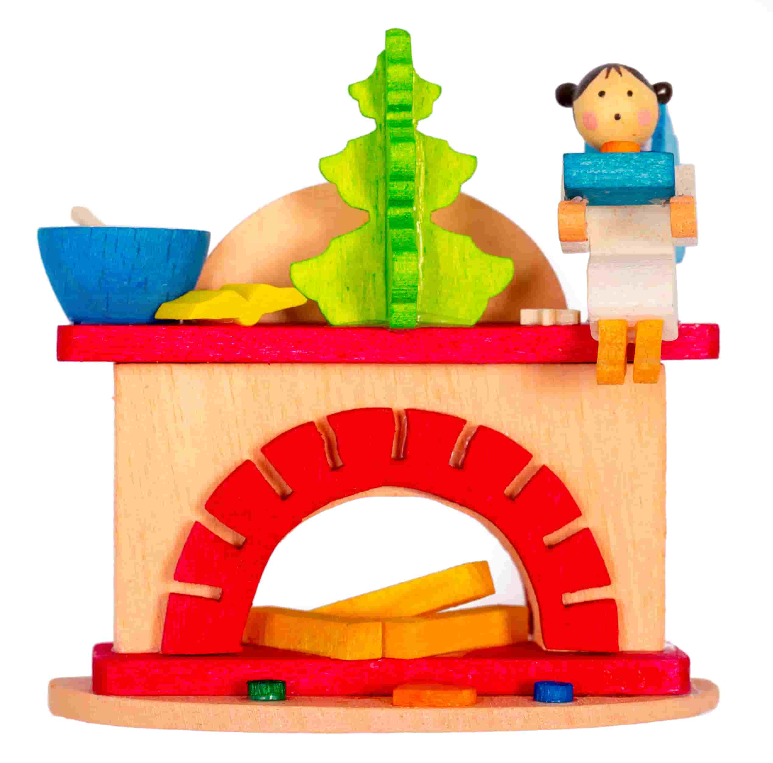 Kleiner Kamin mit Engel als Baumschmuck