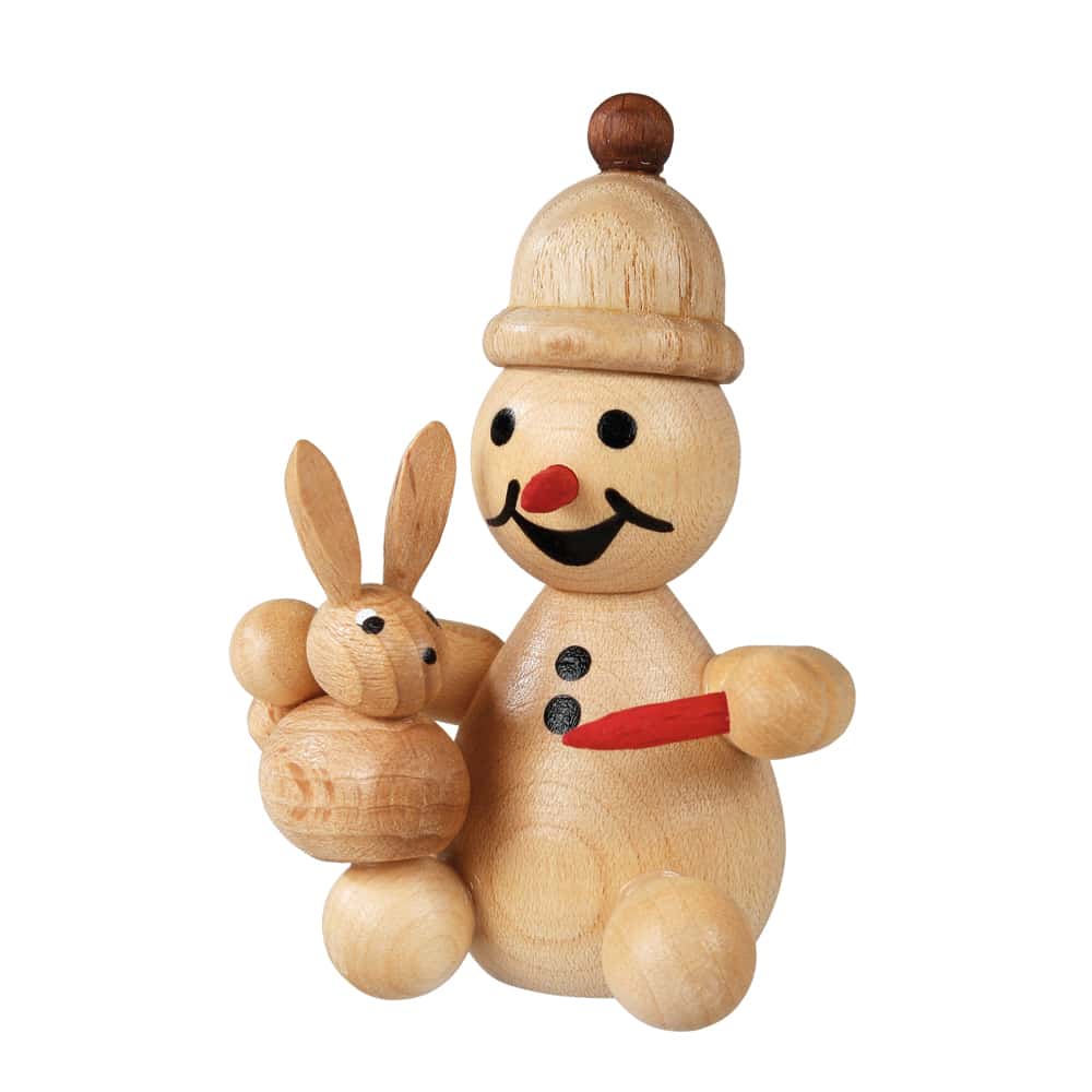 Schneemann Junior sitzend Hase füttern