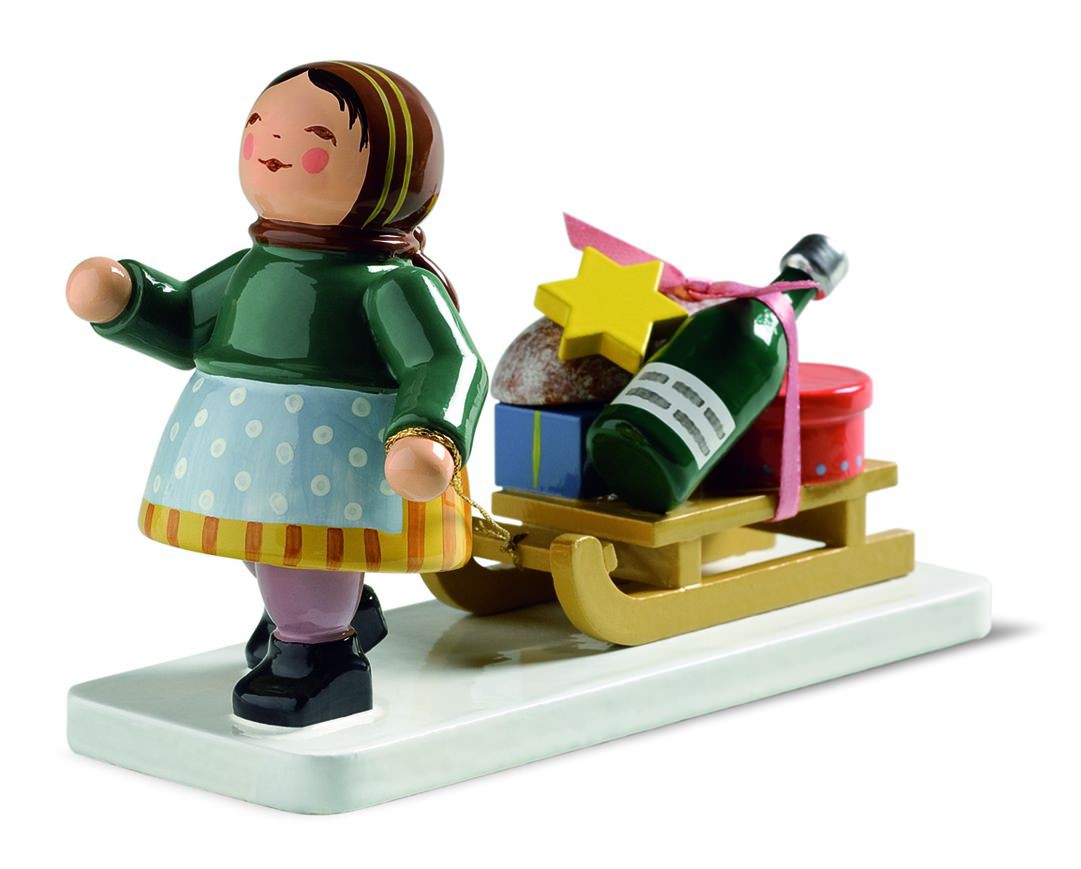 Winterkinder Mädchen mit Schlitten