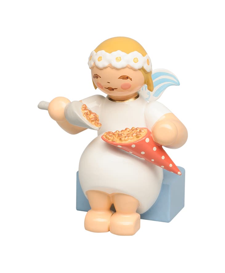 Margeritenengel sitzend mit gebrannten Mandeln