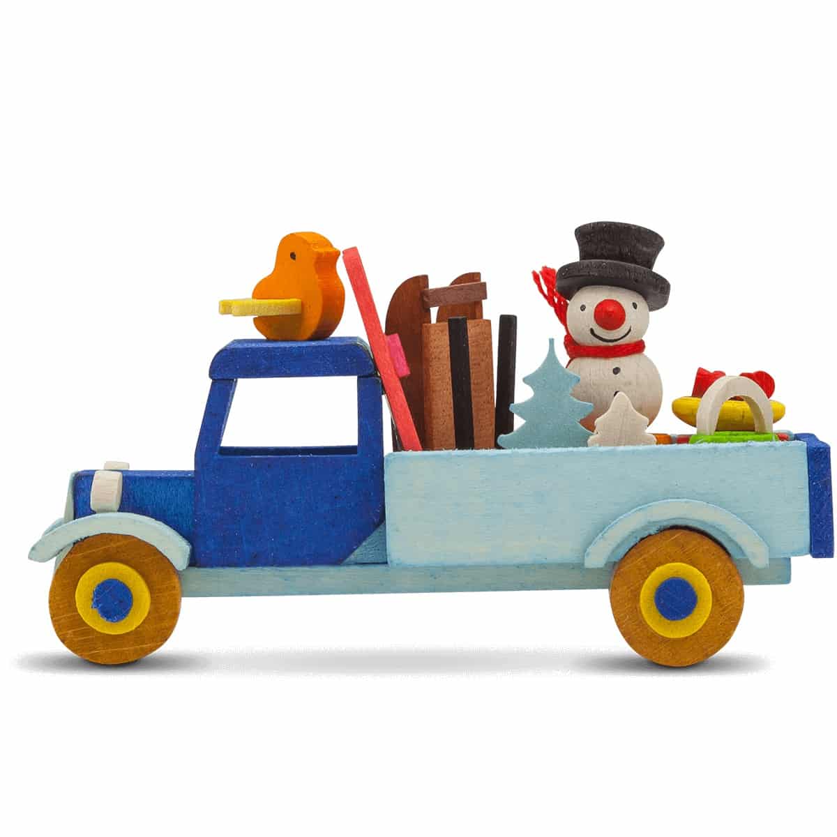 Lastwagen mit Schneemann und Ski als Baumschmuck