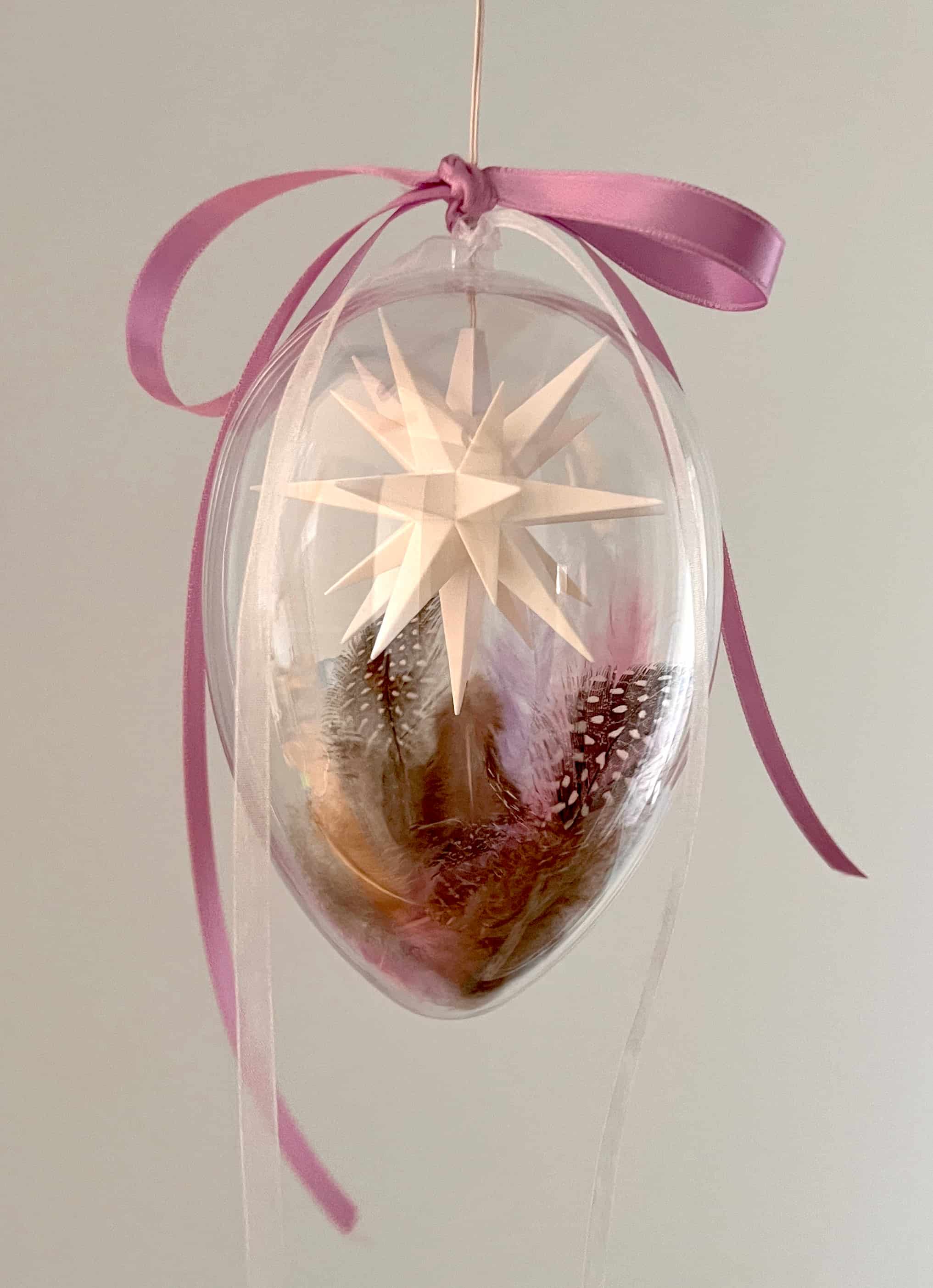 Original Herrnhuter Miniaturstern im Osterei - lila/weiß