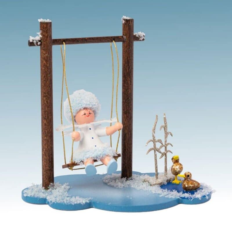 Schneeflöckchen auf Wolke mit Schaukel